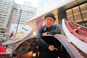 A collaborator working with artist Kacey Wong to make egg waffles with an artistic twist, East Point Road, Causeway Bay, 31 January 2016