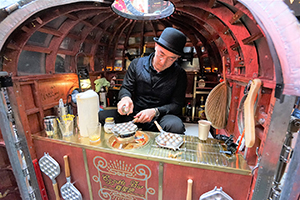 A collaborator working with artist Kacey Wong to make egg waffles with an artistic twist, East Point Road, Causeway Bay, 31 January 2016