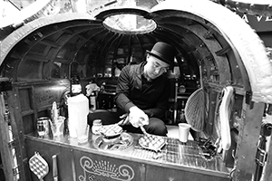 A collaborator working with artist Kacey Wong to make egg waffles with an artistic twist, East Point Road, Causeway Bay, 31 January 2016