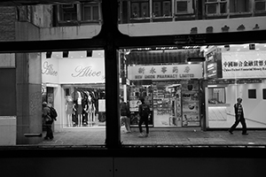 Street scene viewed through tram windows, Des Voeux Road Central, Central, 2 January 2016