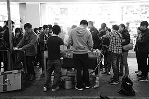 Hawkers selling street food at night, Mongkok, 9 February 2016