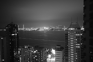 Victoria Harbour and Stonecutters Island at night, viewed from Sheung Wan, 15 February 2016