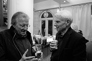 Retired academics Geoff Blowers and Colin Davies in conversation at a St. Patrick's Day party, Mui Wo, Lantau, 13 March 2016