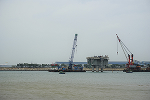 Construction of the Hong Kong - Zhuhai - Macau bridge, with the Hong Kong International Airport at Chek Lap Kok visible behind, 20 March 2016