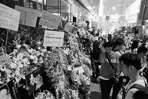 Memorials placed outside the Mandarin Oriental Hotel, Central, in remembrance of actor and singer Leslie Cheung, on the anniversary of his suicide, 1 April 2016