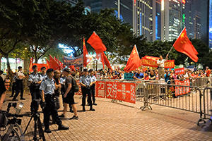 People waving PRC national flags  on the occasion of a 'Belt and Road Summit', Wanchai, 18 May 2016