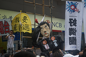 Citizens' Radio and a figure of Leung Chun-ying at the annual protest march, Hennessy Road, Causeway Bay, 1 July 2016