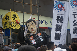 Citizens' Radio and a figure of Leung Chun-ying at the annual protest march, Hennessy Road, Causeway Bay, 1 July 2016