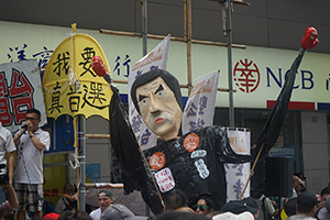 Citizens' Radio and a figure of Leung Chun-ying at the annual protest march, Hennessy Road, Causeway Bay, 1 July 2016