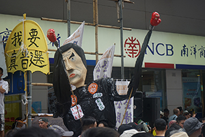 Citizens' Radio and a figure of Leung Chun-ying at the annual protest march, Hennessy Road, Causeway Bay, 1 July 2016