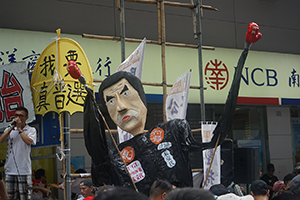 Citizens' Radio and a figure of Leung Chun-ying at the annual protest march, Hennessy Road, Causeway Bay, 1 July 2016