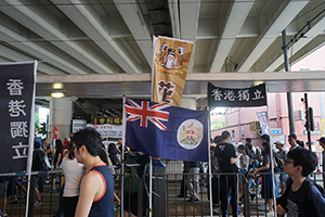 Hong Kong independence banners and the colonial era flag of Hong Kong seen at the annual protest march, Hennessy Road, Causeway Bay, 1 July 2016