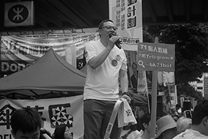 Democracy activist Benny Tai Yiu-ting addressing demonstrators at the annual protest march, Hennessy Road, Wanchai, 1 July 2016