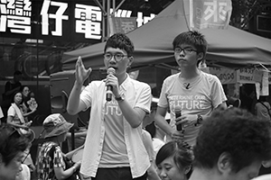 Nathan Law (left) and Joshua Wong (right), leaders of political party Demosisto, addressing demonstrators at the annual protest march, Hennessy Road, Wanchai, 1 July 2016