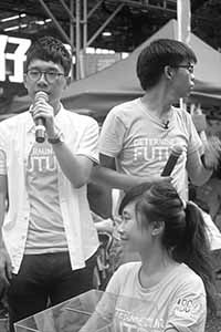 Nathan Law (left) and Joshua Wong (right), leaders of political party Demosisto, addressing demonstrators at the annual protest march, Hennessy Road, Wanchai, 1 July 2016