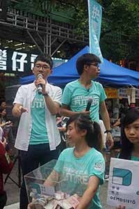 Nathan Law (left) and Joshua Wong (right), leaders of political party Demosisto, addressing demonstrators at the annual protest march, Hennessy Road, Wanchai, 1 July 2016