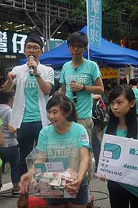 Nathan Law (left) and Joshua Wong (right), leaders of political party Demosisto, addressing demonstrators at the annual protest march, Hennessy Road, Wanchai, 1 July 2016