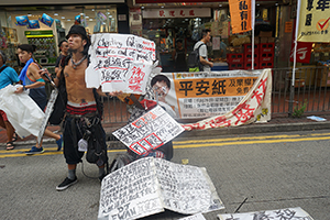 A demonstrator at the annual protest march, Hennessy Road, Wanchai, 1 July 2016