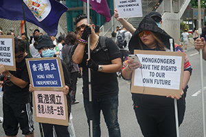 Demonstrators calling for Hong Kong independence at the annual protest march, Hennessy Road, Wanchai, 1 July 2016