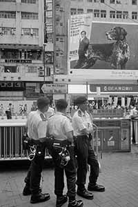 Police at the annual protest march, Yee Wo Street, Causeway Bay, 1 July 2016