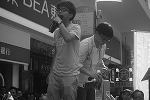 Joshua Wong (front) addressing demonstrators at the annual protest march, Yee Wo Street, Causeway Bay, 1 July 2016