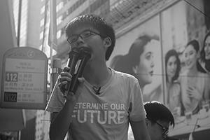 Joshua Wong addressing demonstrators at the annual protest march, Yee Wo Street, Causeway Bay, 1 July 2016