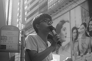 Joshua Wong addressing demonstrators at the annual protest march, Yee Wo Street, Causeway Bay, 1 July 2016