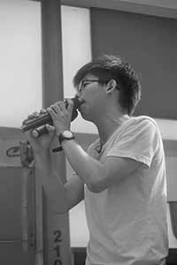 Joshua Wong addressing demonstrators at the annual protest march, Yee Wo Street, Causeway Bay, 1 July 2016