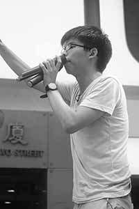 Joshua Wong addressing demonstrators at the annual protest march, Yee Wo Street, Causeway Bay, 1 July 2016
