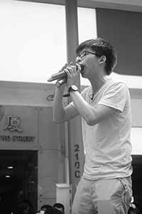 Joshua Wong addressing demonstrators at the annual protest march, Yee Wo Street, Causeway Bay, 1 July 2016