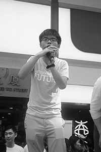Joshua Wong addressing demonstrators at the annual protest march, Yee Wo Street, Causeway Bay, 1 July 2016