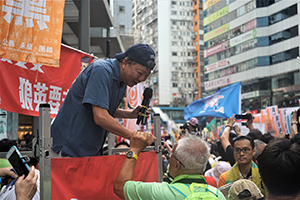 Lee Cheuk-yan of the Labour Party addressing demonstrators at the annual protest march, Hennessy Road, Causeway Bay, 1 July 2016