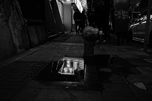 Reflection of a restaurant sign in a water puddle, Lok Ku Road, Sheung Wan, 22 April 2017