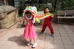 Children playing with a lion dance costume, Queen's Terrace, Queen Street, Sheung Wan, 6 February 2019