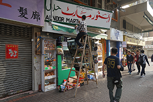 Painting a shop sign, Sham Shui Po, 5 February 2019