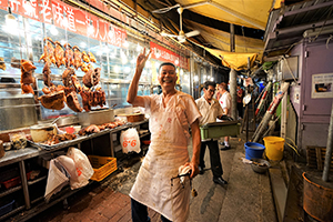 Staff member at a roast meat store, Wing Lung Street, Kowloon,  5 February 2019