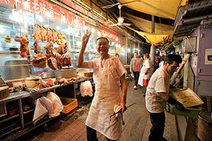 Staff member at a roast meat store, Wing Lung Street, 5 February 2019