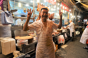 Staff member at a roast meat store, Wing Lung Street, Kowloon, 5 February 2019