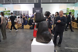 Wang Keping (right) and his sculpture, Art Basel, Wanchai, 27 March 2019