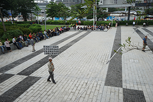 Man with a banner protesting against the extradition bill, in the area outside the Legislative Council entrance, Admiralty, 4 May 2019