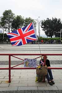 Protester with a British flag, in the area outside the Legislative Council entrance, Admiralty, 4 May 2019