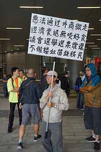 Protester with a banner, in the area outside the Legislative Council entrance, Admiralty, 4 May 2019
