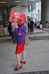 Protester with a sign, in the area outside the Legislative Council entrance, Admiralty, 4 May 2019