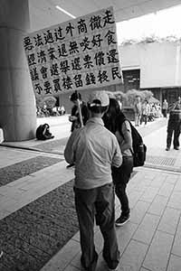 Protester with a banner, in the area outside the Legislative Council entrance, Admiralty, 4 May 2019