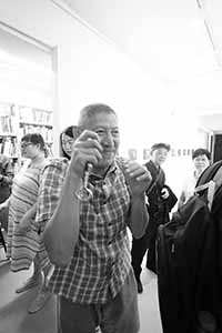 Photographer Tse Ming Chong, at the opening of an exhibition of work by Lee Ka Sing, Lumenvision, Jockey Club Creative Arts Centre, 8 June 2019