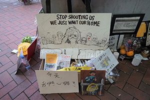 A makeshift shrine for a protester who died in a fall, outside Pacific Place, Admiralty, the site of the accident, 20 June 2019