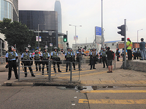 Police line on the junction of Lung Wui Road and Fenwick Pier Street, 12 June 2019