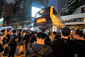 Roads in Central occupied by protesters, with marooned bus, 12 June 2019