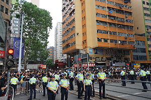 Police blocking roads during a march from Causeway Bay to Admiralty against the extradition bill, 16 June 2019