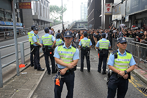 Police blocking a road during a march from Causeway Bay to Admiralty against the extradition bill, 16 June 2019